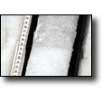 An ice core from Nun Kun showing the spring season dust bands we used to determine annual layers needed to date the core. (PAM)